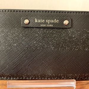 Black/Sparkle Kate Spade credit card/ID holder. Never used. New w/o tags.
